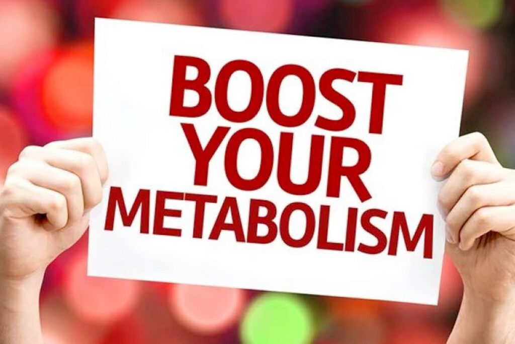 person holding boost your metabolism sign